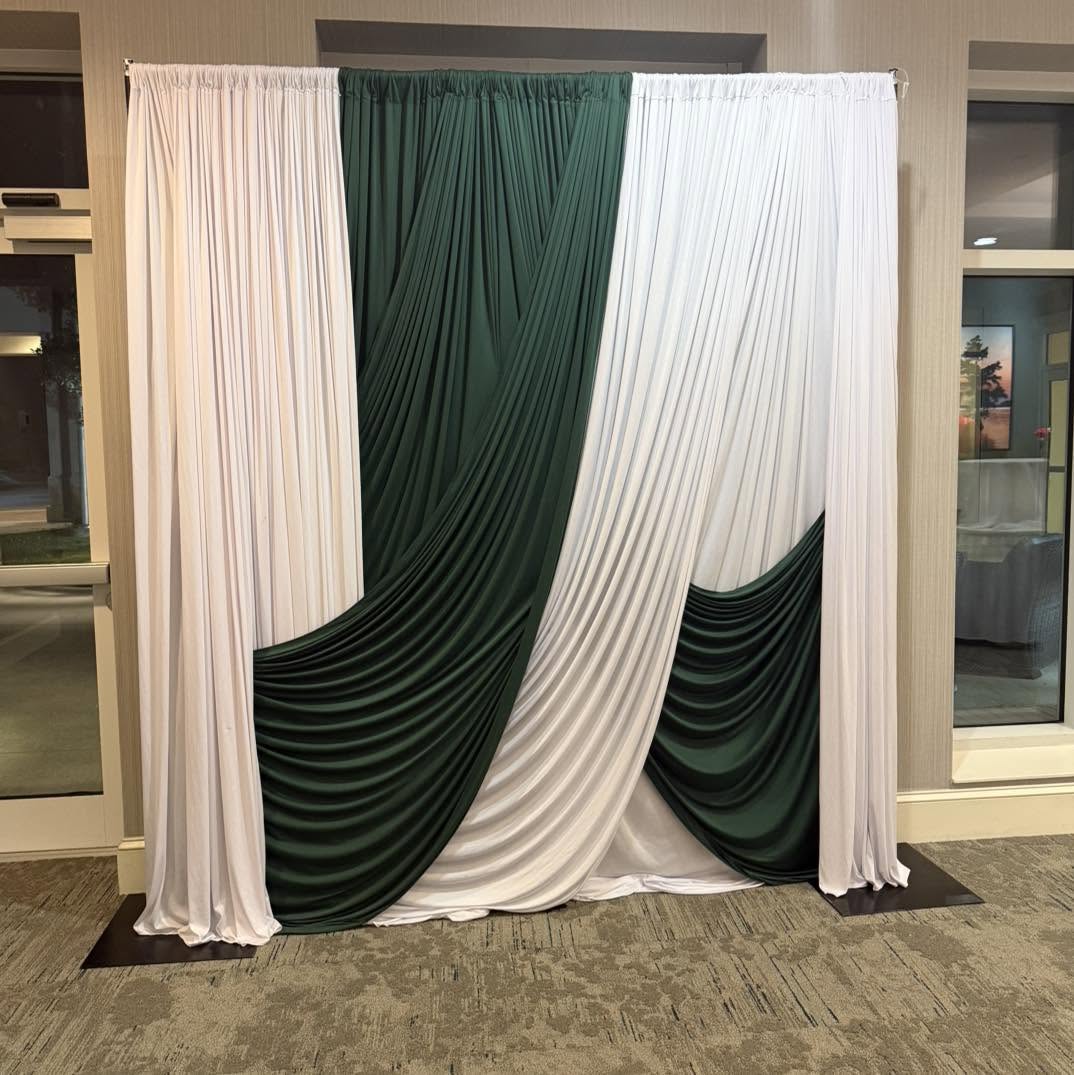 Emerald and white swagged pipe and drape backdrop