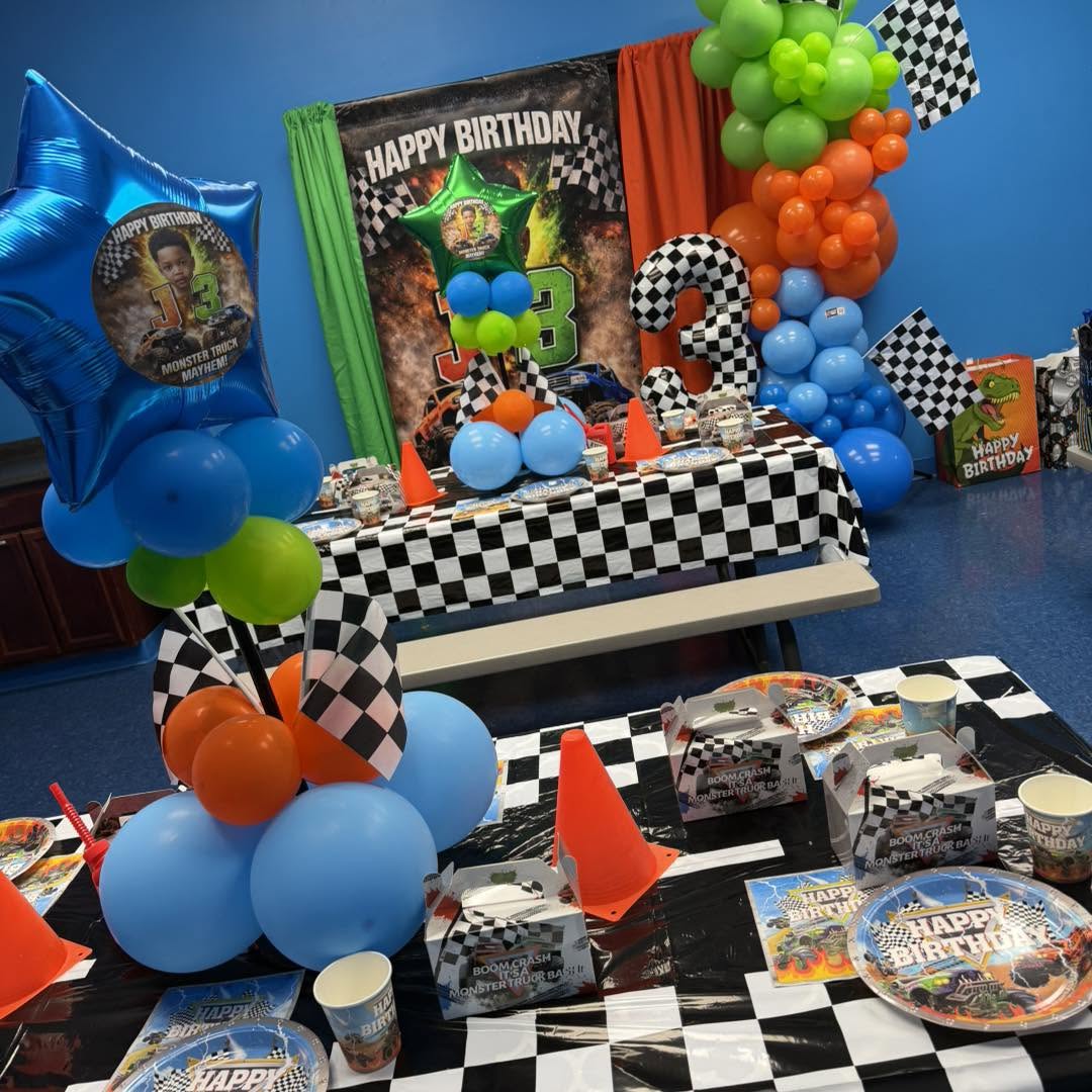 Themed cut-out props and printed décor at a kids party