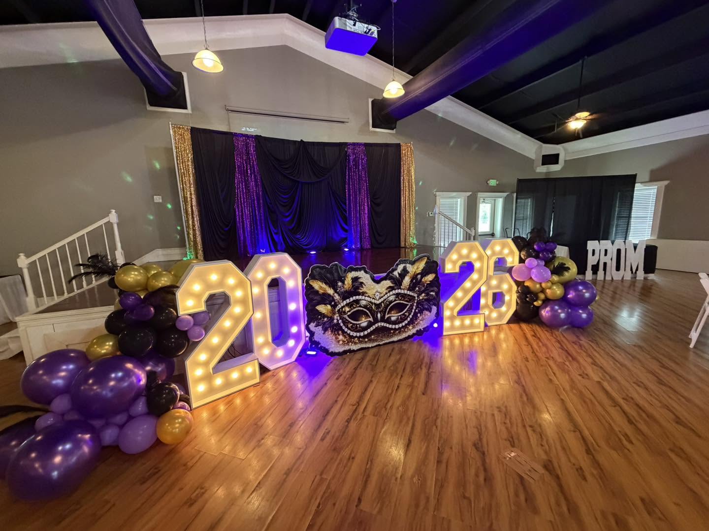 Mardi Gras prom with illuminated 2026 numbers