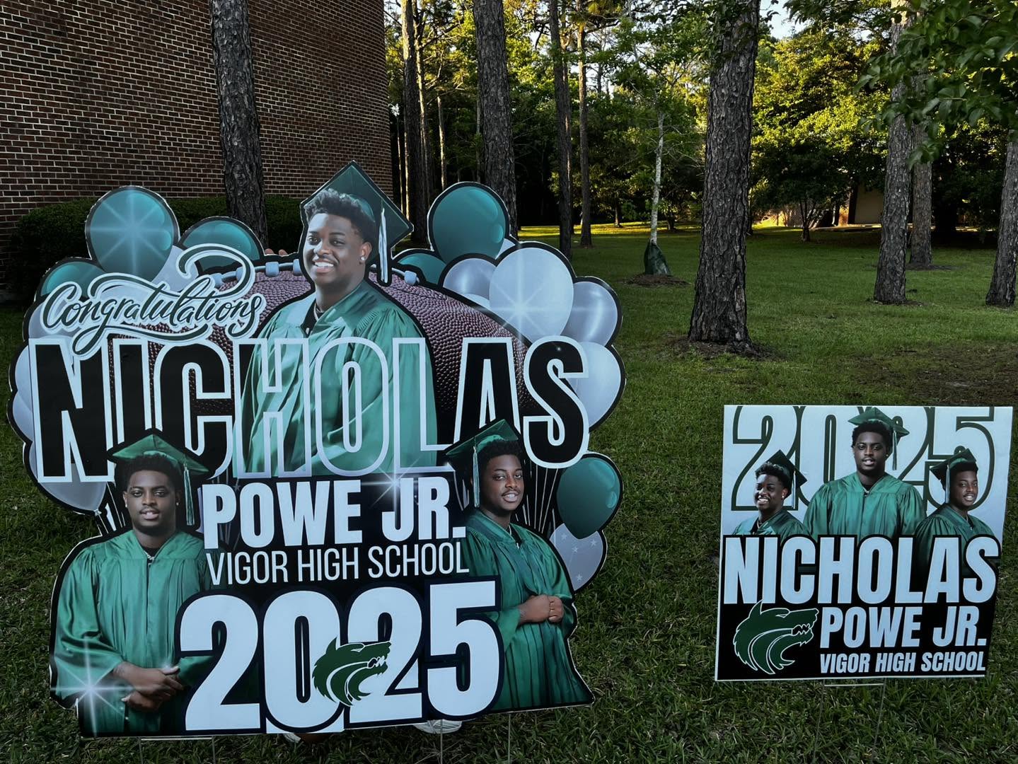 Custom cut-out graduation yard signs with photos and balloons