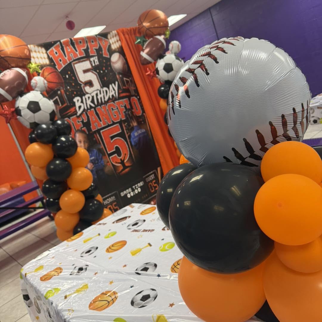 Sports-themed children's birthday setup with balloon décor