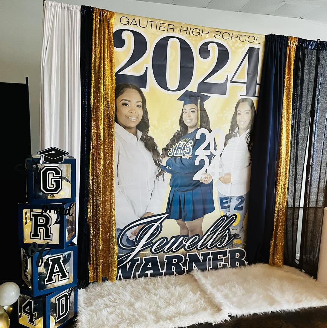 Custom printed graduation photo banner displayed with draping