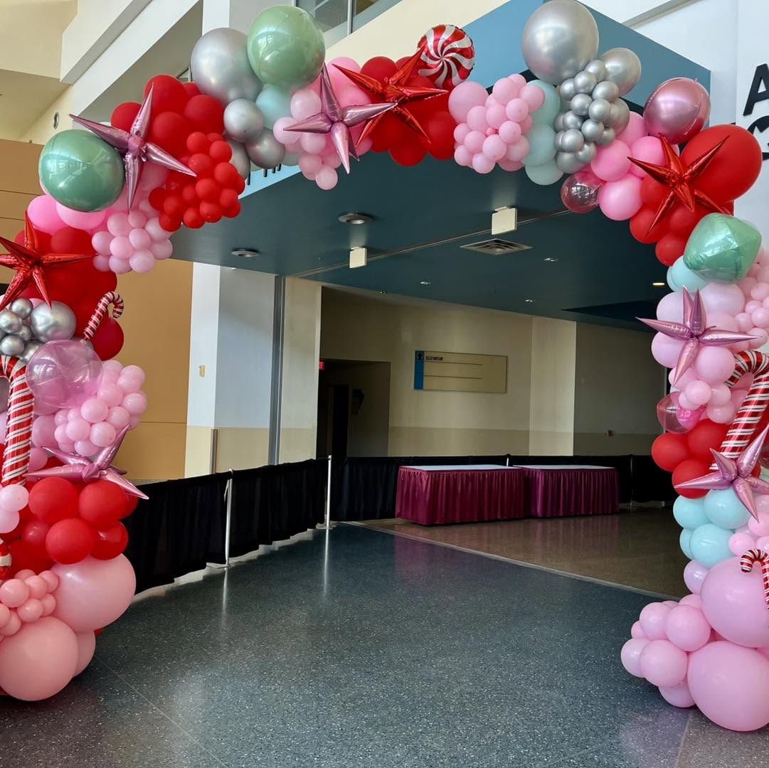 Red, pink and mint peppermint balloon arch
