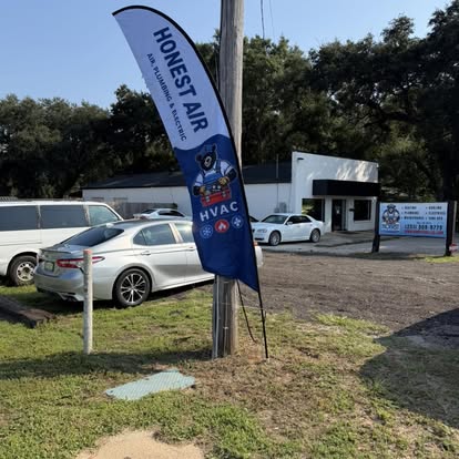 Custom printed Honest Air feather flag for a business grand opening